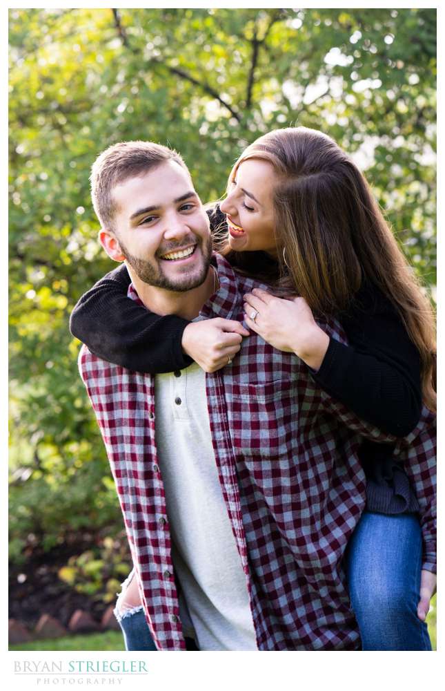 piggy back ride during engagement photo